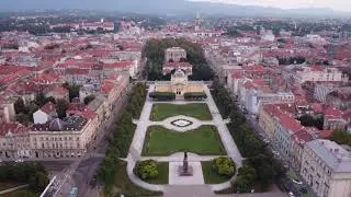 Zagreb Croatia - Train, King Tomislav Statue, and Park Josipa Jurja Strossmayera - Drone - Day - 4k