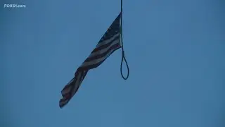 Crane cable hoisting a flag at CCSU construction site looked like a noose