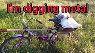 Digging for scrap metal.