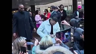 Chris Brown chatting and signing fans&rsquo; stuff today in London