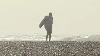 Beachgoers brave Brighton seafront despite Storm Eunice | AFP