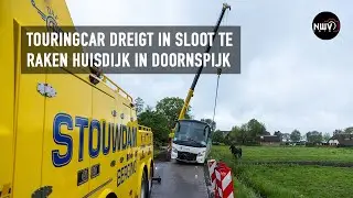 Brandweer opgeroepen voor touringcar die in de sloot dreigt te raken