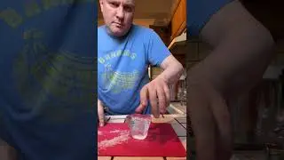Carving an ice diamond with a chisel.