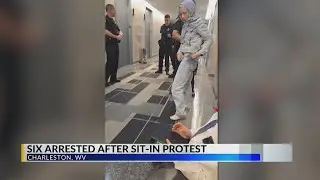 Six arrested after sit-in protest