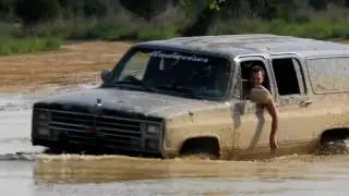 suburban hitting another deep mud hole