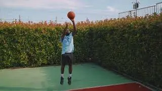 VideoVault Stock Video: Basketball player dribbles and then throws the ball