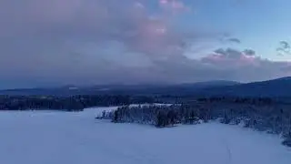 Hyper-lapse Over Spectacle Pond in Brighton, Vermont Just Before Sunset On January 22, 2026