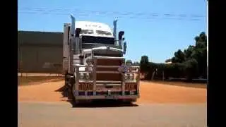 KW 909 Toll Triple Roadtrain leaving Broome