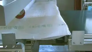 Film wrapping machine for doors furnture windows etc