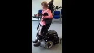 Merry trying out the Sit to Stand function on a Permobil wheelchair.