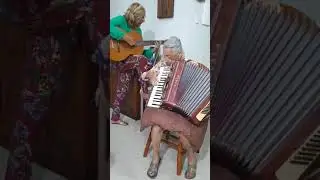 Old lady playing Accordion with her daughter|guitar|accordion|