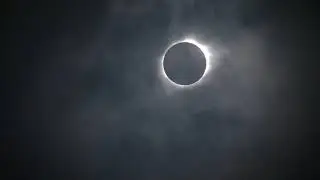 Total solar eclipse emerges from behind clouds in Nebraska
