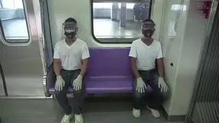 Manila police test run new distancing rules on trains
