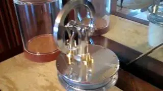 Stirling engine I made running on heat.  Its sitting on a cup of hot water