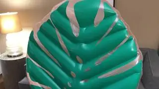Deflating large inflatable tropical palm leaf float