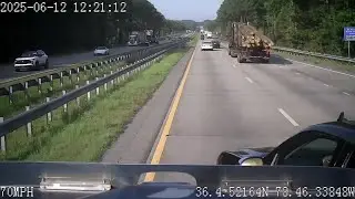 Dashcam video shows the moments a log truck overturns on I-85