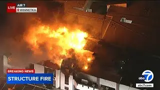 1 person hospitalized after large fire breaks out at commercial building in Los Angeles