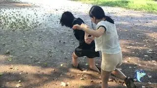 Two girl run in mud with dress