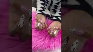 Painting the nail tips with colorful polka dots