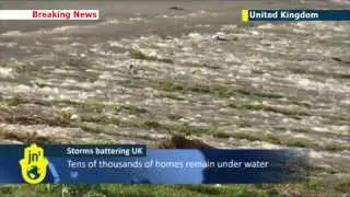 British soldiers build barriers to stem UK floods: Royal Marines swap Afghanistan for Somerset
