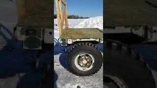 A/M32K-4 Rough terrain wagon repurposed as a round bale carrier