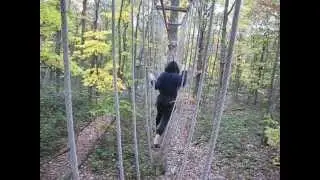 Jessica going across using Ropes - at Tree Tops Adventure Course