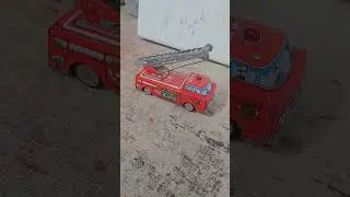 Vintage SH Trade Mark tin lithographed battery-operated fire engine ladder truck