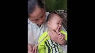 A Poor Mother and Her Son Searching for Wild Vegetables to Survive