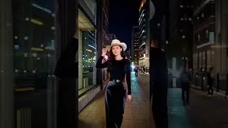 Fashion shoot look: a long velvet dress layered with a sleek black top, finished wit cowgirl hat
