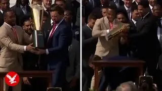 JD Vance drops college football trophy in front of Ohio State team