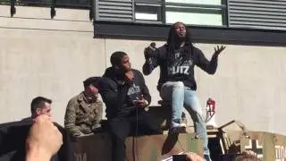 Richard Sherman and Bobby Wagner telling stories on a tank