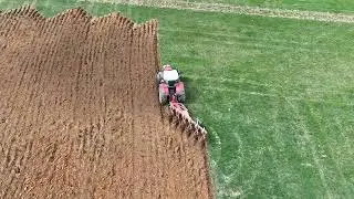 Plowing with a Massey 8732 and Kuhn 6 bottom rollover plows