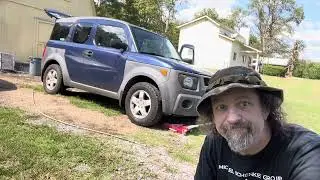 Replacing a Honda Element valve stem while removing Slime sealant from a tire.