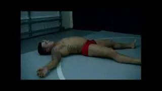 steel knocks out marco with a full nelson