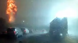 Dramatic lightning strike causes tower of flames next to motorway