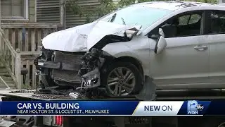 Car slams into building