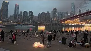 Jialing riverbank viewing point by Qiansimen bridge showing the magnificent Chongqing city skyline.