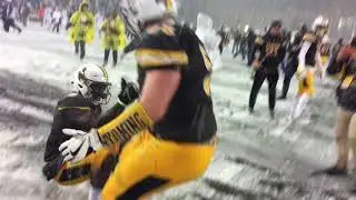 Wyoming football celebrates with the Bronze Boot after a 16-13 win