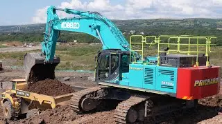 Big Kobelco SK850 Excavator Loading Trucks
