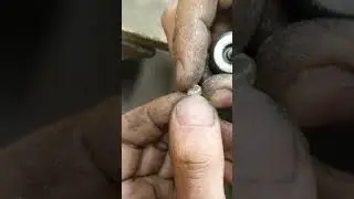 cleaning up outer edges of the baby pansy shell , sterling silver