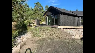Doing some stone work and spreading out soil in a slope. Completely redoing someone's yard. Part 16.