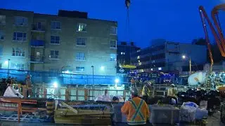 Crane used to lift injured construction worker out of subway construction hole