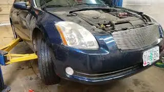 How hard can it be to change a Maxima headlight bulb?