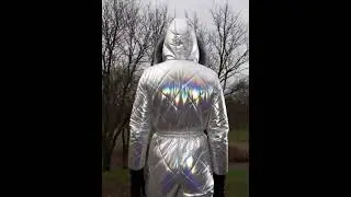 Walking in white and silver amalgam ski overalls and a black mask panoramic CM-6