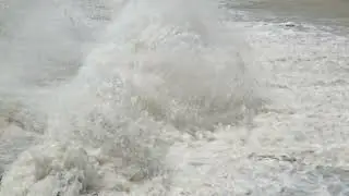 row of chute dentate blocks in concrete water spillway channel slope slowing down splashing flow of