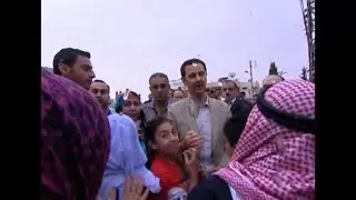 Syria's Assad pays Easter visit to old Christian town