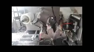 Automatic box cellophane overwrapping machine