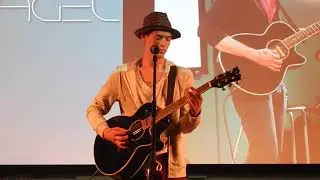 Nagel performing an original song at May TNT