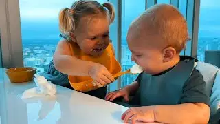 Naomi feeds baby brother David