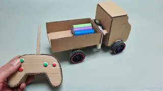 Homemade remote-controlled cardboard dump truck with a self-tipping bed
